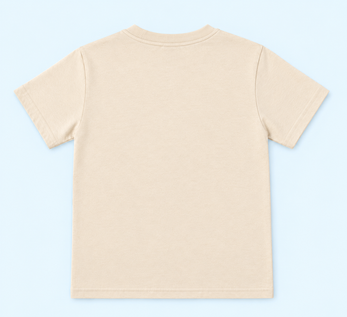 Child wearing a beige bear graphic T-shirt