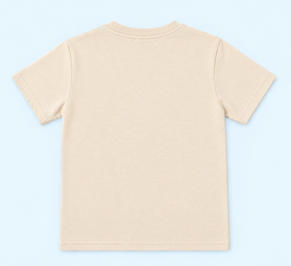 Child wearing a beige bear graphic T-shirt